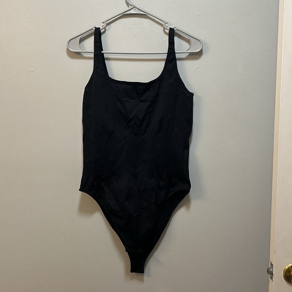 OQQ bodysuit with tank straps. Size XXL. Suck ya in REAL good.